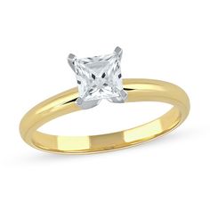 a gold ring with a princess cut diamond