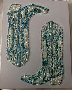 the letter j is made out of beads