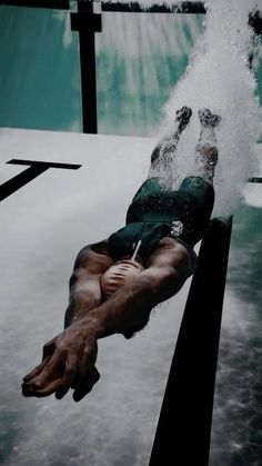 a man falling off his surfboard into the water while riding a wave in an artistic photo