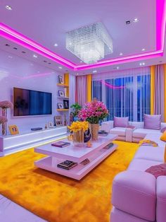 a living room with yellow and pink decor in the center, white couches and coffee table