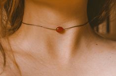 "This is a minimalist cord necklace featuring a single carnelian stone on our brown waterproof cord. This necklace is finished with a backdrop where the cord ends drape down your upper spine and end with a copper embellishment. Fully adjustable with a sliding knot closure and can be worn as tight as a choker or any length of necklace you desire! ✺ SIZE GUIDE ✺ ⌁ This choker is designed with a sliding knot closure and can comfortably adjust to as tight as you need while the maximum length is 24\" Dainty Necklaces, Carnelian Jewelry, Carnelian Necklace, Choker Pendant, Cord Ends, Jewelry Dainty, Dope Jewelry, Crystal Choker, Funky Jewelry