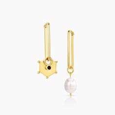 Elongated Sabrina Hoop Earrings w. Lucia x Lilou (onyx cubic zirconia) Charm on one side x Colette Pearl Charm on the other. Earrings : 14k Gold Vermeil [29.5mm x 9mm x 2mm] Charms : 14k Gold Plated [Pearl: Average 10mm] [Octagon: 16mm x 13mm x 2mm] [Onyx CZ: 7mm x 2mm]