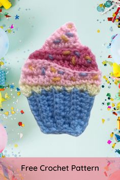 a crocheted cupcake with sprinkles and confetti on it