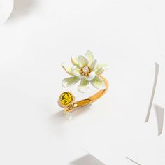 Gardenia Ring is a flower ring from Selenichast jewelry store. This is from nature jewelry and according its material, it??s also enamel jewelry which can be adjusted. Dress up your hand with this delicate ring. This adjustable flower ring features a white gardenia facing a yellow faceted glass stone. Simple yet delicate. This stylish designer jewel is almost perfect for all occasions and help add a touch of femininity and brightness to your outfits. Yellow Gold Enamel Flower Jewelry, Gold Enamel Flower Ring For Anniversary, Yellow Gold Enamel Flower Ring Gift, Enamel Flower-shaped Jewelry For Wedding, Flower-shaped Enamel Jewelry For Wedding, Flower Shaped Enamel Jewelry For Wedding, Enamel Flower Shaped Wedding Jewelry, Flower Shaped Enamel Wedding Jewelry, Floral Enamel Wedding Jewelry