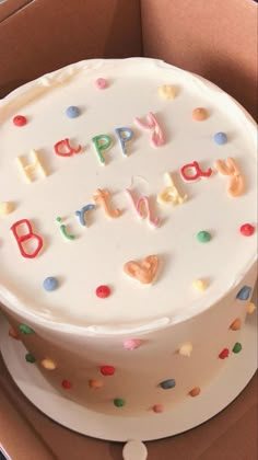 a birthday cake in a box with the words happy birthday written on it and confetti sprinkles