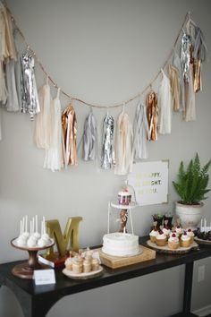 a table with cupcakes and cakes on it