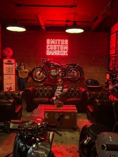 a room filled with lots of motorcycles and couches