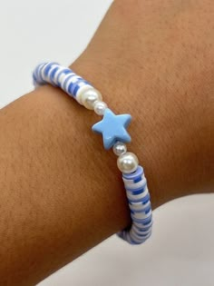 Handmade 7 in. preppy beaded bracelet. Contains periwinkle, white, and blue  6mm clay beads. Also has pearl beads, and a cute turtle bead!! This is a super cute blue themed or summer bracelet! It's perfect for a gift for yourself or anyone else!!  I can custom create any jewelry for you. Just let me know what colors you want, and if you want a word on it or not. I can also make phone charms and rings, and necklaces. White Periwinkle