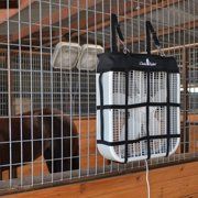 an animal in a cage that is being held up by a wire fence with a black bag hanging from it's side