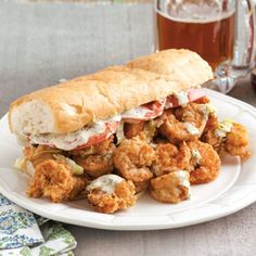 a sandwich and some fried food on a plate