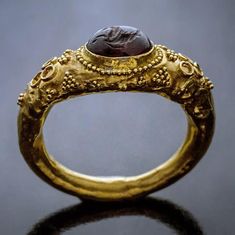 A museum quality ancient Roman gold ring, circa 1st century AD. This hollow gold ring (approximately 21K) is bezel-set with a garnet intaglio of Hippocamp – a fish-tailed horse that was considered the horse of Poseidon in Greco-Roman mythology. Poseidon was the god of the sea, earthquakes, and Ancient Roman Jewelry, Ancient Jewels, Grandmother Jewelry, Bijoux Art Nouveau, Roman Jewelry, Ancient Jewellery, Long Pearl Necklaces, Historical Jewellery, Medieval Jewelry