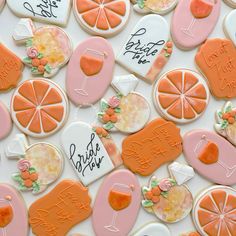 decorated cookies with orange slices and cocktails on them for a brunch party