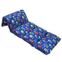 a child's futon bed with blue and red transportation print