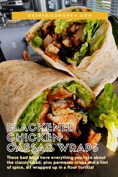 a chicken caesar wraps with lettuce and other ingredients on the wrap is shown