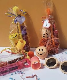 some toys are sitting on a table next to bags and other items that have been placed around them