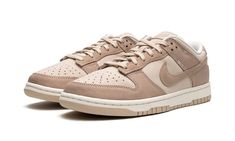 The Women’s Nike Dunk Low “Sanddrift” is a women’s-exclusive colorway of the vintage basketball shoe that features a versatile appearance.  The “Sanddrift” Dunk Low is complete with a light tan leather base with contrasting dark tan suede overlays and Swoosh branding.  Tonal “Nike” detailing is embroidered onto the heel.  Additional “Nike” branding can be found on the tongue tag.  A Sail midsole and Sanddrift rubber outsole put the finishing touches on the design.  Release date: March 4, 2023 Womens Dunk Low, Nike Low Dunk, Nike Dunks Low, Dunks Outfit, Pretty Sneakers, Streetwear Accessories, Shoes Sneakers Nike, Stadium Goods, Swag Shoes