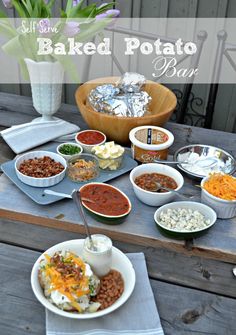 a table topped with bowls and plates filled with food