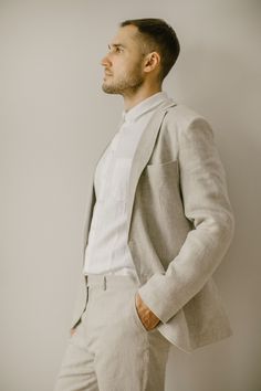 "Our men's simple wedding suit (set of 3) is handcrafted to fit your individual body measurements. We take pride in the fact that there are no factory processes involved in making our linen clothes for men. Each linen suit ensemble is made with care and attention to detail. SIZING To ensure the perfect fit of this men's linen suit, I will email you after you place your order, kindly requesting the measurements. This way, the cut will be tailored precisely to unique body shape. THE PROCESS WILL BE VERY SIMPLE AND EASY! I am here to assist you throughout the entire process, addressing any questions or concerns you may have. Color in the picture: natural linen and snow white. Other colors are available. The model in the picture is 186 cm (6'1\") tall and is wearing size L. DESCRIPTION: Our si Beige Linen Suit For Wedding, Linen Wedding Suit With Suit Collar, Wedding Linen Set With Notch Lapel, Wedding Linen Sets With Notch Lapel, Single-breasted Linen Wedding Suits, Tailored Linen Suit For Wedding, Beige Linen Wedding Suit, White Linen Wedding Blazer, Simple Wedding Suit