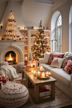 a living room decorated for christmas with candles and decorations on the fireplace mantels