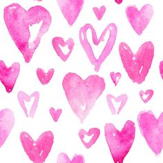 pink hearts painted in watercolor on white paper