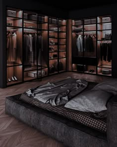 a large closet with clothes and shoes in it