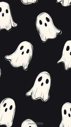 black and white halloween ghost fabric with large, ghostly faces on it's sides