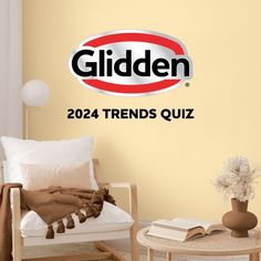 a room with a couch, table and chair next to a wall that has the words gilden on it