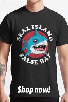 a man wearing a black t - shirt that says seal island false bay shop now