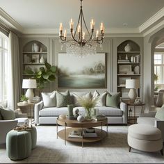 a living room filled with furniture and a chandelier