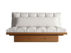 a white couch sitting on top of a wooden shelf