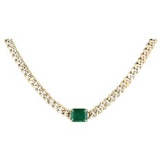 A remarkable emerald necklace in gold. This extravagant piece features a stunning natural emerald cut emerald that showcases a rich dark green color and very good clarity and luster. Set in a secure four-prong claw setting, attached to a lovely, hollow Cuban link chain that measures 4.5mm in width and measures 16 inches in length. The perfect accessory. Setting Style: Prong Setting Material: 14K Yellow Gold Setting Weight: 8.5 Grams Main Stone: Emerald Shape: Emerald Cut Weight: 1.90-Carats Clar Cuban Link Choker, Gold Cuban Link Chain, Dark Green Color, Claw Setting, Emerald Necklace, Yellow Gold Setting, Rich Green, Chain Choker Necklace, Cuban Link Chain