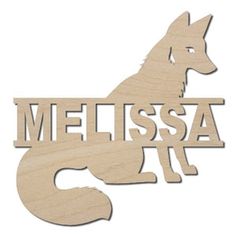 a wooden cutout of a wolf with the word mississippi on it's chest