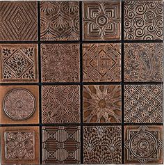 several different types of decorative tiles are arranged in a grid pattern, each with an intricate design