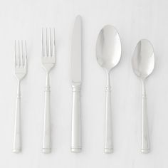 five forks, two spoons and one knife on a white surface