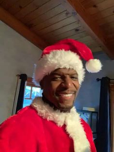 a man wearing a santa suit and hat