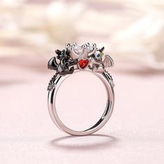 Can you believe it? This dragon couple's relationship is one of the strongest romance relationship in the fictional world. Crafted in sterling silver, this ring in Hug Me® collection shows a loving couple sitting on either side of the polished band. As a great Valentine and Christmas gift, the meaningful ring celebrates your everlasting love. You will find more adorable and creative designs in our Hug Me® collection.Carat Weight: 2.5 ctStone Size: 7 mmStone Type: Jeulia® StoneNumber of Stones: 1 Dragon Couple, Jeulia Jewelry, Meaningful Rings, Couple Sitting, Couple Relationship, Fictional World, Hug Me, Stone Heart, Red Garnet