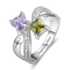 two stone ring with names engraved on the sides and diamonds in each band, one is yellow