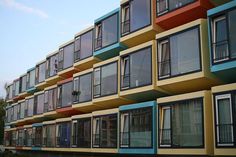 an apartment building with many windows and balconies