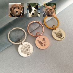 four different key chains with pictures of dogs and cats on them