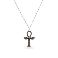 an egyptian symbol necklace on a chain with the letter o in silver and black diamonds