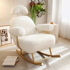 a white rocking chair in a living room