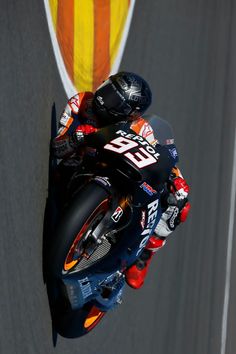 a person riding a motorcycle on a race track