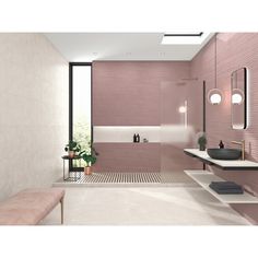 a bathroom with pink walls and flooring next to a bench in the middle of the room