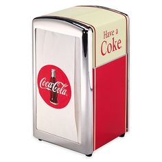 an old fashioned coca cola cooler with a coke bottle in it