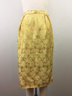 "Fab 1950s-early 60s gold floral brocade top and skirt set. Boxy style top buttons in back and has front bow detail. Pencil skirt zips at the side. No label, but fits like an XS. Condition - noticed a small mark at shoulder and skirt has a couple places where seam has come loose (see pics). Otherwise great! TOP Shoulders - 15.5\" Bust - 37\" Waist - 36\" Length - 19\" Sleeves - 16\" SKIRT Waist - 25\" Hip - 36\" Length - 26.5\" Follow us on Instagram@flashbackvtg !" Elegant Yellow Skirt For Wedding, Vintage Formal Skirt, Gold Skirt For Spring Formal Occasion, Elegant Full Skirt In Gold, Elegant Gold Full Skirt, Elegant Gold Cocktail Skirt, Brocade Top, Teal Blazer, Early 60s