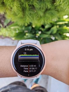 a close up of a person's wrist with a smart watch on the screen