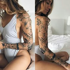 a woman sitting on top of a bed covered in tattoos