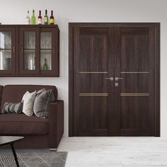 a living room filled with furniture next to a wall mounted wine rack and cabinet doors