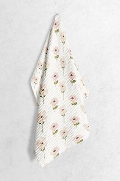 a white napkin with pink flowers on it