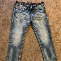 Men’s Blue & Cream Rock Revival Jean Never Worn Size 38 Rockstar Jeans Men, Rock Revival Jeans Mens Outfit, Rock Revival Jeans Mens, Cowboy Jeans, Men’s Bootcut Jeans, Luxury Mid-rise Men's Jeans, Vintage Blue Pre-washed Jeans, Rock Revival Jeans, Denim Jeans Men